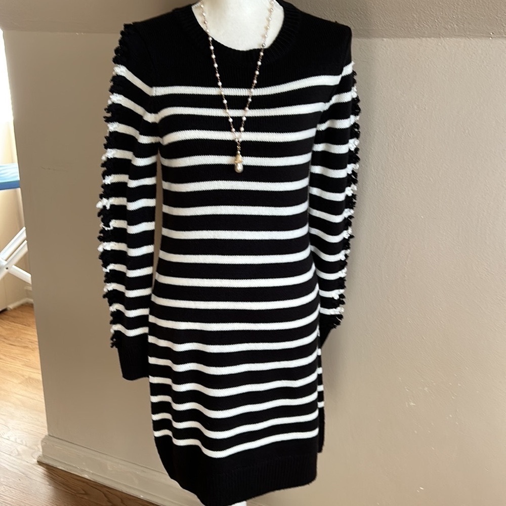 Eliza J black and cream striped sweater dress with knotted fringe sleeve.